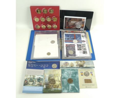 A collection of coins and stamps, including A Battle of Trafalgar £5 commemorative coin, a 2003 Concorde commemorative £5 coi