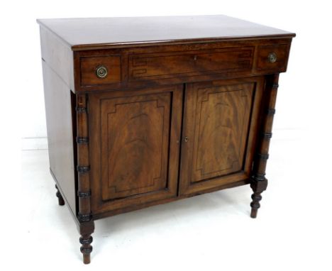 A Regency mahogany and ebony strung dressing cabinet, lift lid (missing mirror) revealing an open compartment, two narrow fri