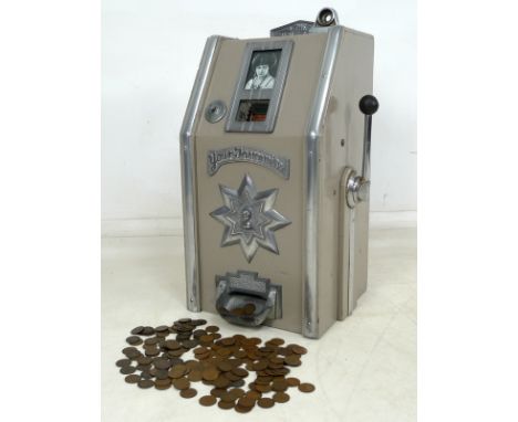 A vintage 1940's one arm bandit penny slot machine, 'The Film Stars', with single barrel depicting named actors and mechanism