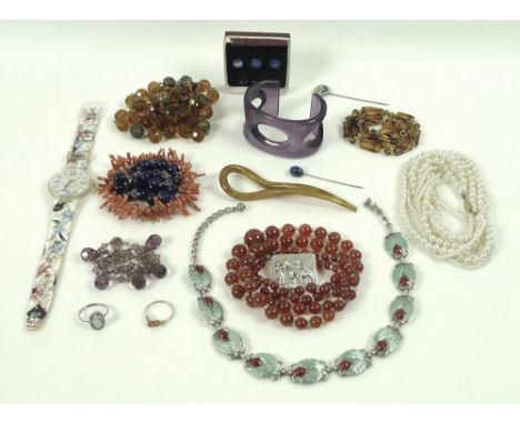 A collection of jewellery, including a salmon pink coral branch bracelet, a carnelian bead necklace formed of two rows of gra