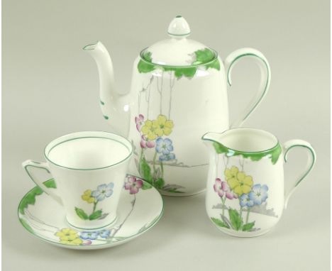 An Art Deco bone china part coffee set, all hand painted with green, pink, yellow and blue over transfer printed floral desig