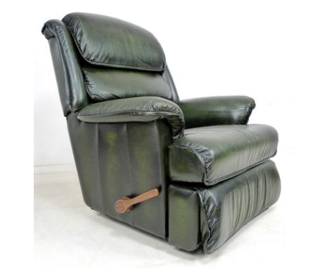 A modern La-Z-Boy reclining armchair, upholstered in green leather, with manual lever reclining action, 92 by 98 by 104cm hig