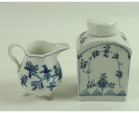A late 18th century porcelain tea caddy, fluted body painted in underglaze blue with trailing foliage, unmarked but possibly 