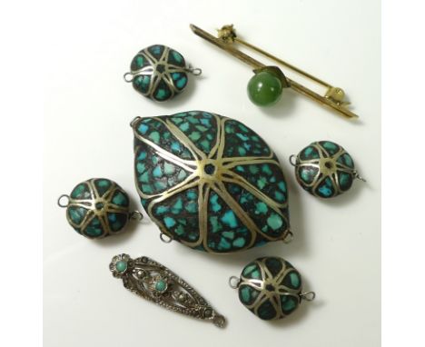 A selection of Mexican silver and turquoise beads, comprising one large bead of 4 by 2.8cm and four smaller beads, together w