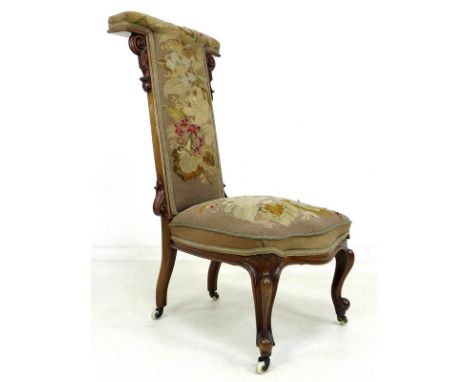 A mid 19th century prie dieu chair, with floral woolwork tapestry seat and back, raised on carved cabriole front legs and whi
