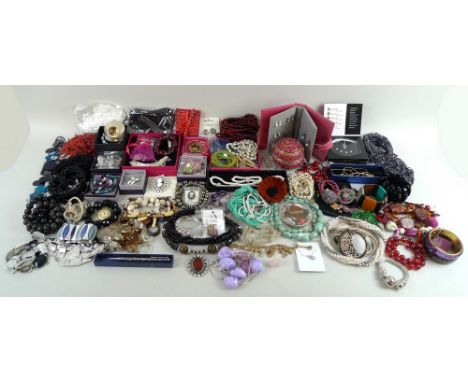 A large quantity of costume jewellery, including ceramic, shell and glass beads, rose quartz and green quartz, coral coloured