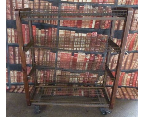 Industrial/haberdashery/shopfitting steel and weldmesh display/shelf unit raised on wheels with an arrangement of weldmesh sh