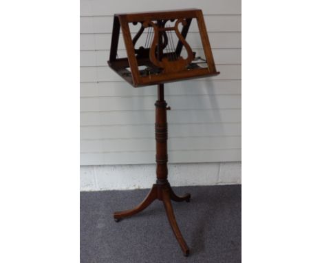 19thC mahogany double sided or duet music stand with lyre decoration, with articulated candle holders to sides, raised on a t