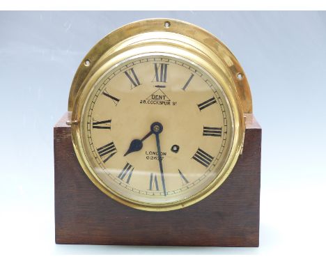 Brass bulkhead/marine clock with Dent, 28 Cockspur Street, London, 62677 to Roman dial, the spring powered two train movement