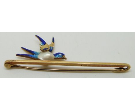 A 15ct gold brooch in the form of a bird/ swallow set with a pearl to the body and enamel, in original Watford box&nbsp;