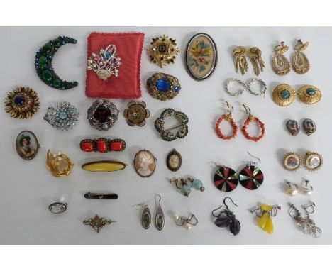 A collection of brooches including Miracle, enamel and filigree brooch, quartz brooch, porcelain brooch. cameo brooches and s