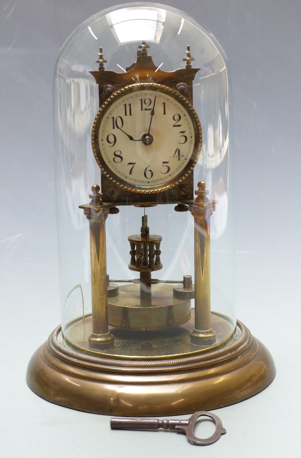 Anniversary clock with key wind movement numbered 22272, under glass