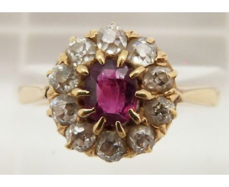 Victorian 18ct gold ring set with an oval cut ruby surrounded by old cut diamonds, 3.3g, size N