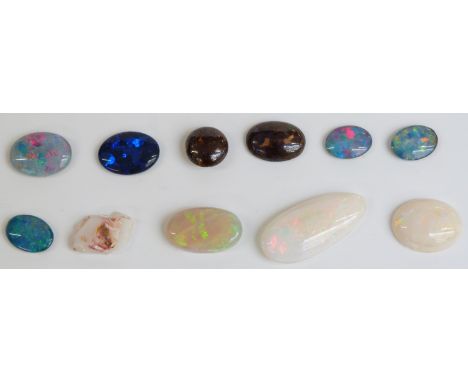 Eleven various opals comprising five triplets, two boulder cabochons and three white examples.&nbsp;