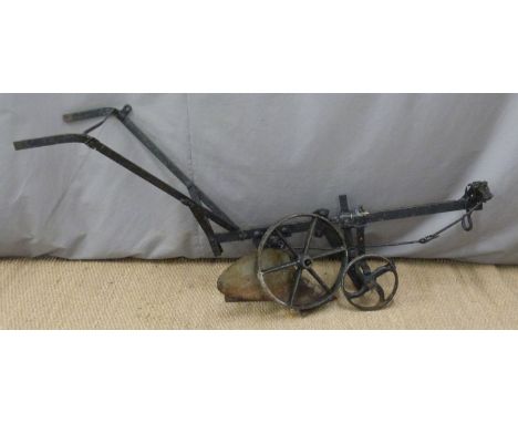 Vintage cast iron horse drawn plough, length 175cm