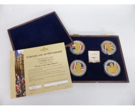 Windsor Mint cased set of four "Year of the Three Kings" proof coins, each coin silver plate with enamel and gold embellishme