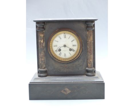 Oak aneroid barometer and a black slate mantel clock with Smith, Cranbrook, Kent to Roman dial, the two train movement striki