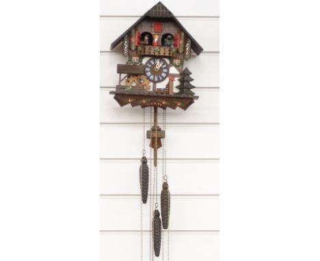 German c1980's musical two train cuckoo clock with automaton feature dancers and water wheel on the hour and half hour, 29cm 