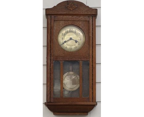 Oak wall clock with two train movement, 59cm tall