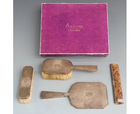 Asprey Art Deco hallmarked silver gilt four piece dressing table set comprising hand mirror, two brushes and a comb, London 1