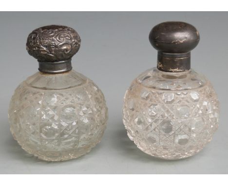 Two hallmarked silver lidded hobnail cut globe shaped dressing table scent or similar bottles, one with hinged lid, height 10