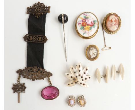 A collection of jewellery including two Victorian cameos, a mother of pearl brooch set with cut steel, mother of pearl cuffli
