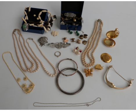 A collection of jewellery including a hallmarked silver flapper bangle, silver and marcasite brooch, a silver ring, silver cu