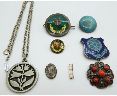 Two badges set with enamel and a fox's head reading 'Do your best' by Collins, ceramic brooch, 9ct gold clasp, pendant by Ten