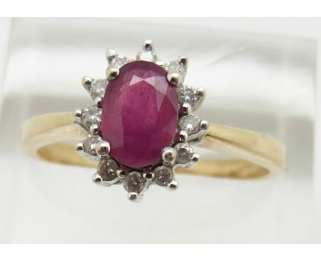 A 9ct gold ring set with a ruby surrounded by diamonds, 3.2g, size S