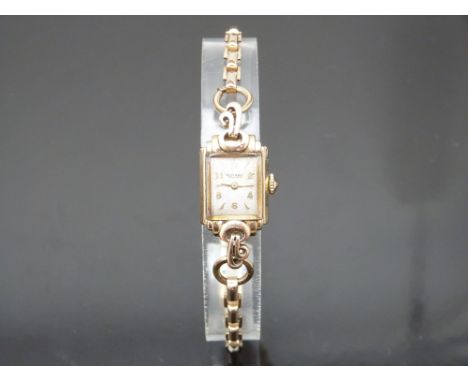 Rotary 9ct gold ladies wristwatch with gold hands and hour markers, silver dial and signed 15 jewel calibre 790 movement, cas