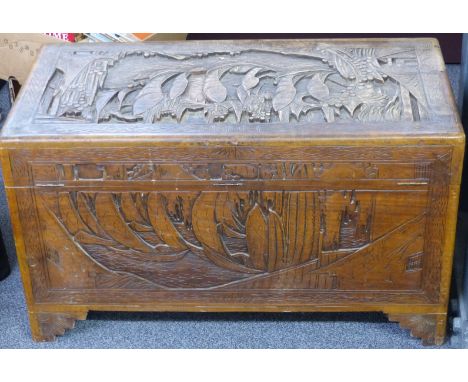 A carved oriental camphorwood trunk, W100 x D50 x H57cm