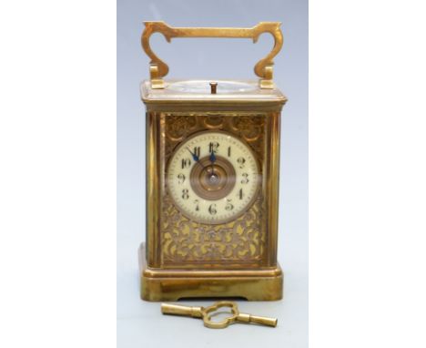 Late 19th/early 20thC brass carriage clock with half hourly repeater mechanism, Arabic ivory coloured enamel chapter ring wit