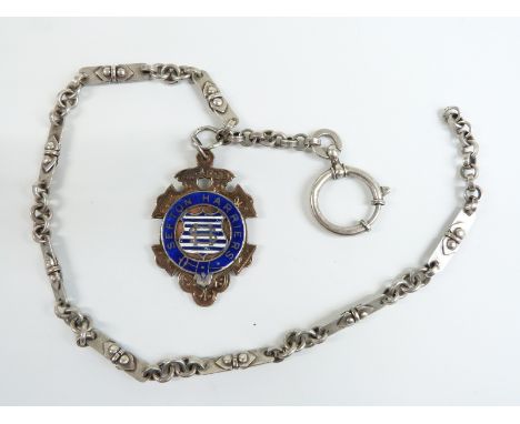 A silver watch chain with a hallmarked silver and 9ct gold fob set with enamel reading 'Sefton Harriers', 35cm