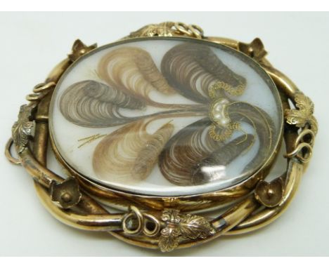 Victorian mourning brooch set with a portrait miniature and verso set with hair, engraved 'Presented to me by my dear father,
