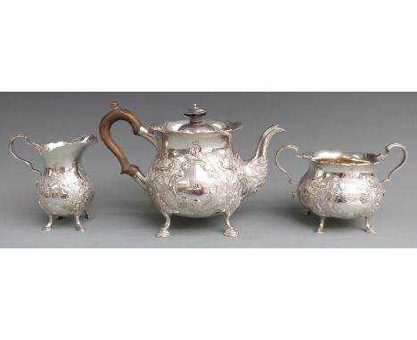 Goldsmiths &amp; Silversmiths Company Ltd Edward VII hallmarked silver three piece teaset with embossed decoration and wavy r