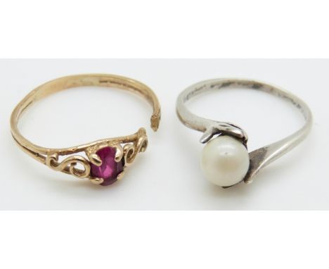 A 9ct gold ring set with a synthetic oval cut ruby and a white metal ring with hands clasping pearl, 2g, size M&nbsp;