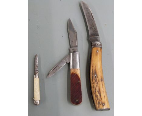 Three vintage penknives, two with horn handles, one stamped Barlow, one with Sayner to blade