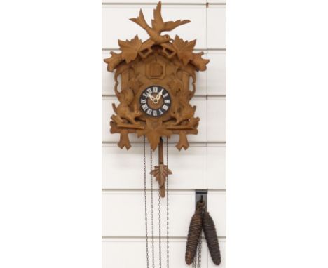 Black Forest mid 20thC cuckoo clock with carved decoration in the form of two squirrels, 30cm tall