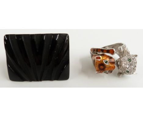 A large designer ring set with carved onyx and a silver ring in the form of two cats or leopards set with cubic zirconia and 