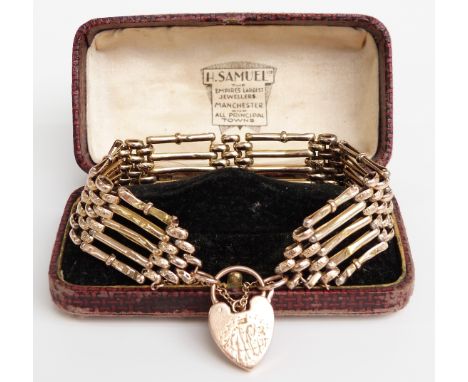 A 9ct gold gate bracelet with a heart padlock clasp, 21g