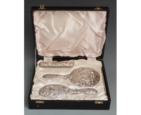 Cased modern hallmarked silver dressing table set, Birmingham 1981 maker Broadway &amp; Co.,comprising hand mirror, two brush