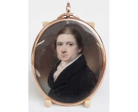 Victorian gold double sided locket set with a painted ivory miniature of a young gentleman, verso set with enamel, seed pearl