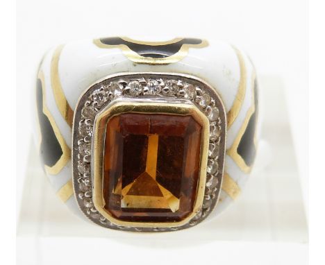 A yellow metal ring set with an emerald cut citrine surrounded by diamonds set with black and white enamel,17g, size M&nbsp;