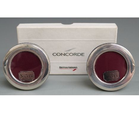 Boxed pair of Concorde hallmarked silver circular photograph frames, with easel backs, overall diameter 6.5cm