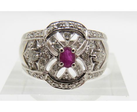 An 18ct white gold ring set with a ruby and diamonds, 6.8g, size N