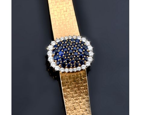 Patek Philippe 18ct gold ladies bracelet wristwatch ref. 4105/1 the dial cover set with 37 round cut sapphires surrounded by 