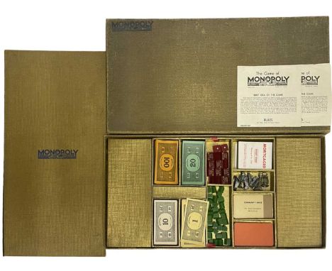 A 1930s gold Monopoly game in original box(unchecked for completeness)