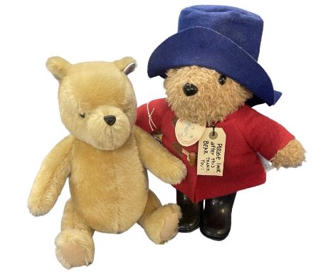 A pair of character teddy bears, to include: - Classic Winnie the Pooh by Gund - Classic Paddington Bear by Eden [purchaed fr