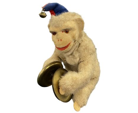 A vintage mohair clockwork monkey,playing the cymbals. Key present.