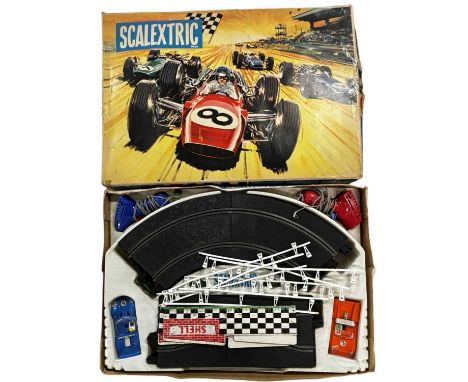A vintage boxed Scalextric set(unchecked for completeness)